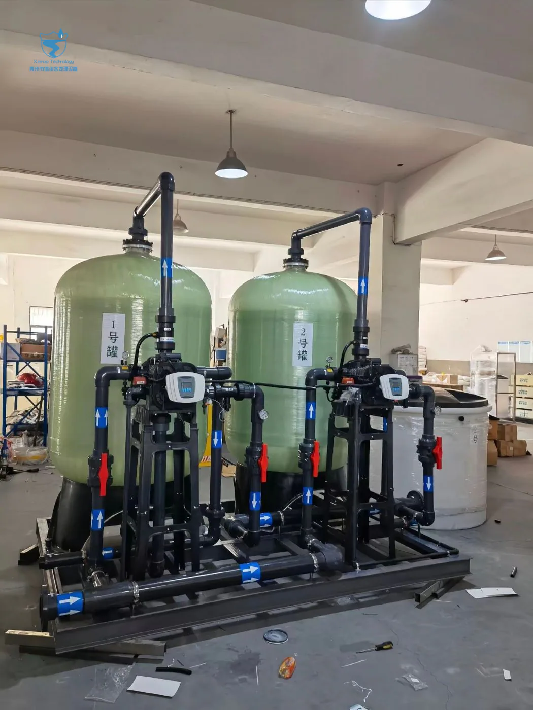 Automatic industrial water softener system with resin vessels and brine tank